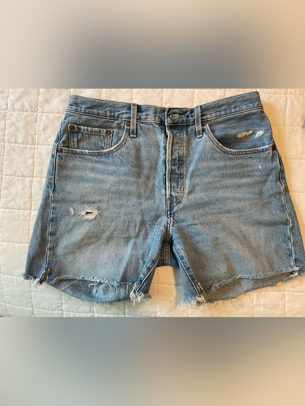 Levi’s Light Wash Distressed Denim Cutoff Shorts